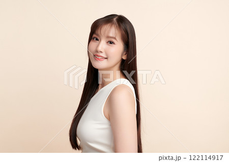 Beautiful young asian woman with clean fresh skin on beige background, Face care, Facial treatment, Cosmetology, beauty and spa, Asian women portrait. Beautiful young asian woman with clean fresh skin on beige background, Face care, Facial treatment, Cosmetology, beauty and spa, Asian women portrait. 122114917