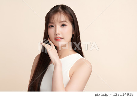 Beautiful young asian woman with clean fresh skin on beige background, Face care, Facial treatment, Cosmetology, beauty and spa, Asian women portrait. 122114919