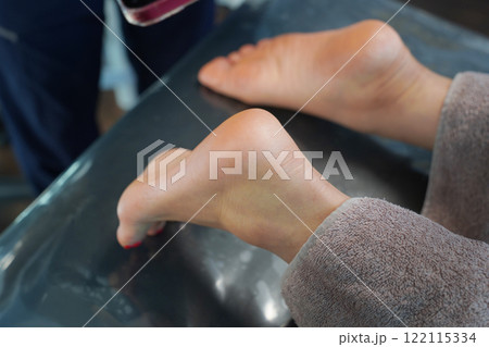 process of foot care in a beauty salon 122115334