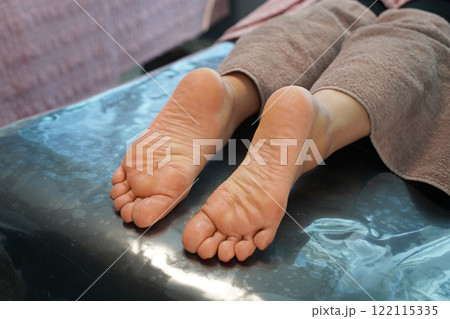 process of foot care in a beauty salon 122115335