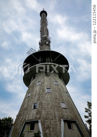 An Iconic Communication Tower Stands Majestically Against a Beautifully Cloudy Sky Above 122115456