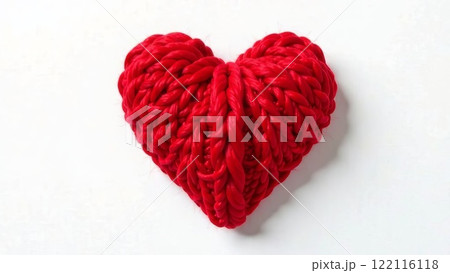 Love heart tied with red yarn isolated on a white background. Symbol of love for Valentine's Day 122116118