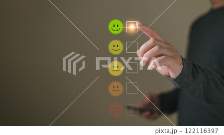 a businessman choose the virtual screen on the happy smile face icon to give satisfaction in service.rating very impressed.customer review service and Satisfaction concept 122116397
