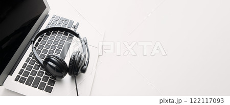 Laptop with a headset on it, helpdesk concept Laptop with a headset on it, helpdesk concept 122117093