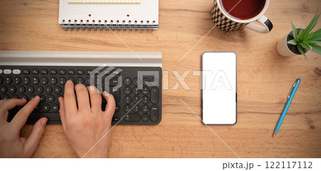 Smartphone mockup, empty screen on desk Smartphone mockup, empty screen on desk 122117112