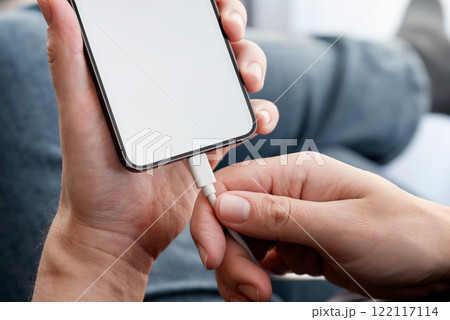 Man charging power to smart phone Man charging power to smart phone 122117114