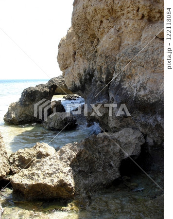 The rocky shores of the Red Sea showcase clear waters and unique rock formations under the sun 122118084