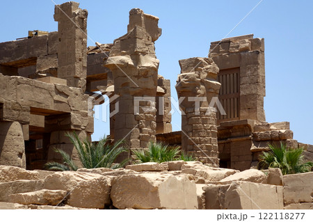 Exploring the Ancient Columns and Ruins at Karnak Temple Complex in Egypt Under a Clear Blue Sky Exploring the Ancient Columns and Ruins at Karnak Temple Complex in Egypt Under a Clear Blue Sky 122118277