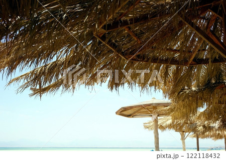 Relaxing Under a Beach Umbrella by the Red Sea Near Paradise Island in Hurghada 122118432
