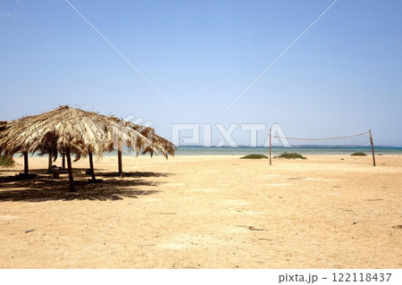 Relaxing Under a Beach Umbrella on Paradise Island Hurghada in the Red Sea Relaxing Under a Beach Umbrella on Paradise Island Hurghada in the Red Sea 122118437
