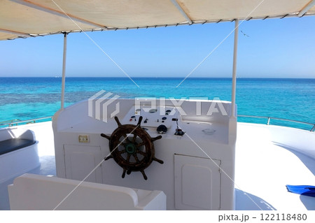 Captain Navigating a Yacht in the Red Sea at a Resort in Egypt Beautiful Waters 122118480