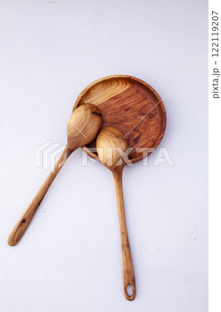 Wooden kitchen utensils stacked view close up isolated 122119207