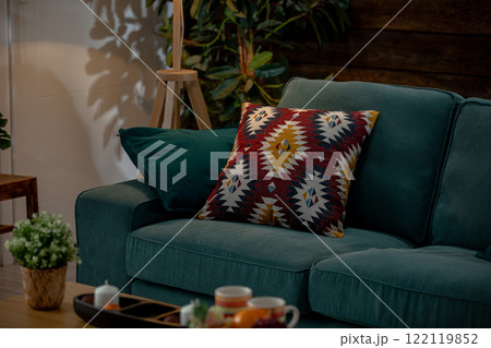 A Cozy Living Room Featuring a Colorful Decorative Pillow That Enhances the Ambiance A Cozy Living Room Featuring a Colorful Decorative Pillow That Enhances the Ambiance 122119852