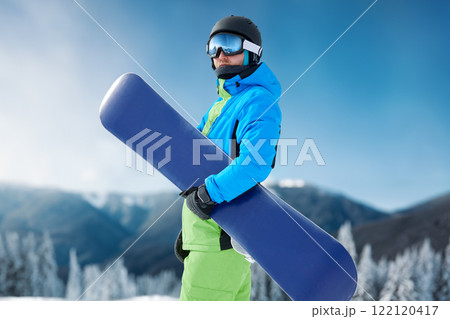 snowboarder and snowboard, portrait on a background of mountains snowboarder and snowboard, portrait on a background of mountains 122120417