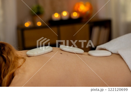 Enjoy the soothing benefits of a Hot Stone Massage for ultimate wellness and tranquility 122120699
