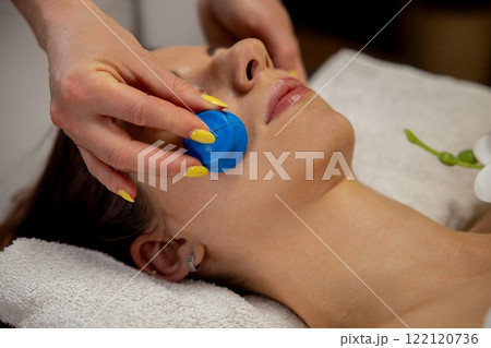 Enjoy a relaxing facial with the blissful Blue Massage Tool to revitalize your skin 122120736