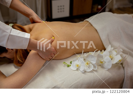 Enjoy a Relaxing and Rejuvenating Massage Therapy Session Enhanced by Fresh Flowers 122120804