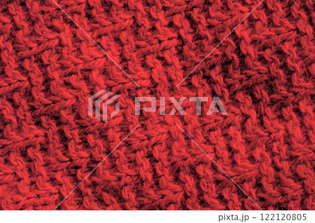 red textured fabric made from wool threads 122120805