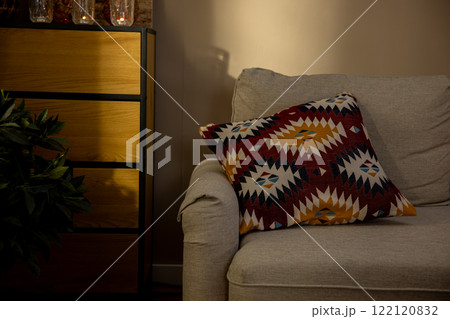 A Cozy and Inviting Living Room Showcasing an Artistic Cushion Gracefully Laid on the Sofa 122120832