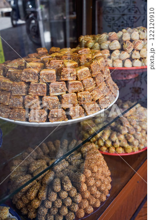 Typical baklava and almond sweets. Pastries stocked on Marrakesh market 122120910