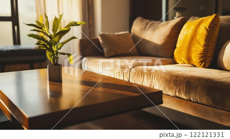 A Cozy Living Room With Abundant Natural Light Streaming In and Featuring an Indoor Plant 122121331