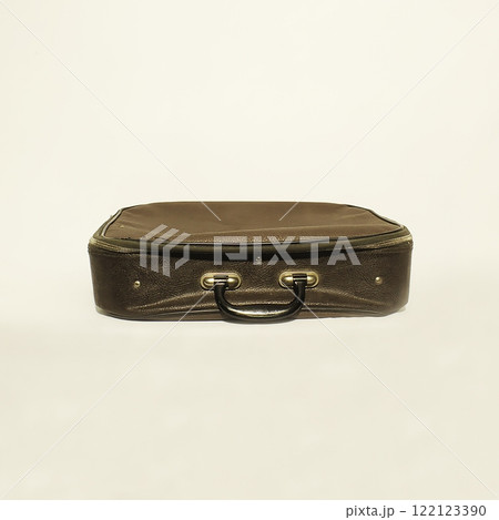 A Vintage Leather Suitcase with a Classic Design Set Against a Neutral Background Setting A Vintage Leather Suitcase with a Classic Design Set Against a Neutral Background Setting 122123390