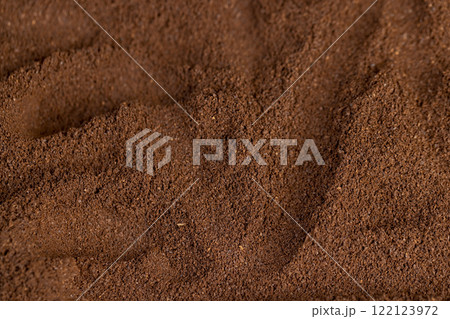 a large amount of ground coffee powder close up a large amount of ground coffee powder close up 122123972