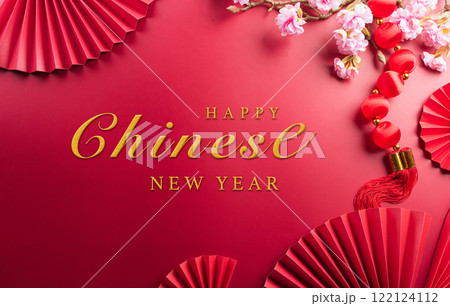 Chinese new year decorations made from plum blossom and gold ingots or golden lump. Chinese characters on the object means to fortune, good luck, wealth, and money flow. Chinese new year decorations made from plum blossom and gold ingots or golden lump. Chinese characters on the object means to fortune, good luck, wealth, and money flow. 122124112