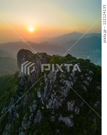 Vertical aerial view of Lion Rock Hill in Hong Kong at sunset 122124135