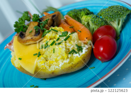 Baked potatoes with cheese, bacon, mushrooms 122125623