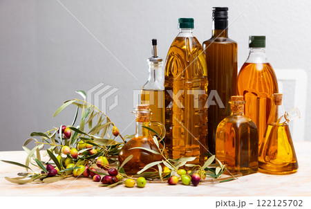 Bottles and carafes with olive oil Bottles and carafes with olive oil 122125702