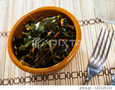 Sea kale salad with carrots served in bowl Sea kale salad with carrots served in bowl 122126112