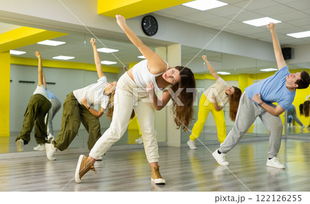 Young girl dancing modern dance in studio 122126255