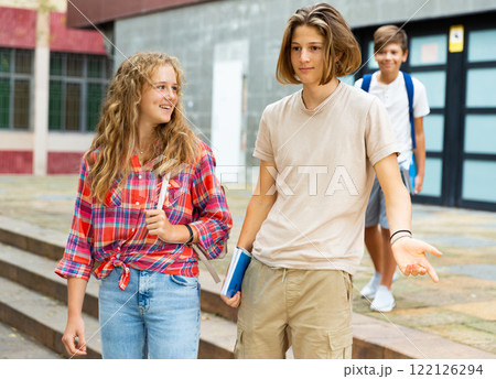 Teens going home after school 122126294