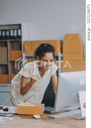 Portrait of Starting small businesses SME owners female entrepreneurs working on receipt box and check online orders to prepare to pack the boxes, sell to customers, SME business ideas online. 122128073