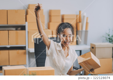 Portrait of Starting small businesses SME owners female entrepreneurs working on receipt box and check online orders to prepare to pack the boxes, sell to customers, SME business ideas online. 122128074