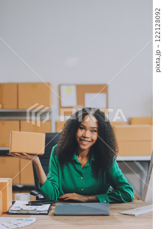 Portrait of Starting small businesses SME owners female entrepreneurs working on receipt box and check online orders to prepare to pack the boxes, sell to customers, SME business ideas online. 122128092