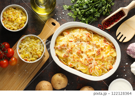 Concept of tasty and delicious homemade food - potato casserole Concept of tasty and delicious homemade food - potato casserole 122128364
