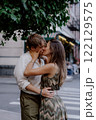 A Romantic Couple Embracing Each Other in a Beautiful Urban Green Setting Surrounded by Nature 122129575
