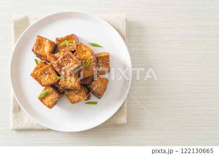 fried tofu with white sesame and teriyaki sauce fried tofu with white sesame and teriyaki sauce 122130665