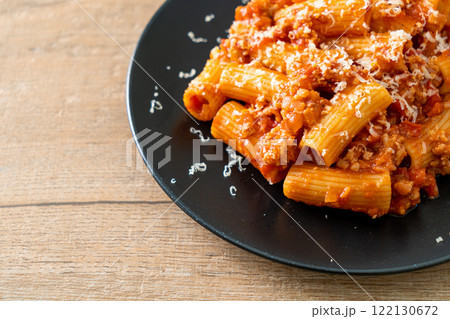 Rigatoni pasta bolognese with cheese Rigatoni pasta bolognese with cheese 122130672