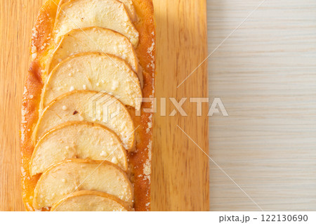 apple loaf crumbled on wood board 122130690