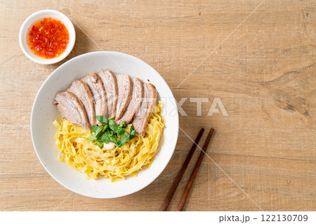 dried duck noodles in white bowl 122130709
