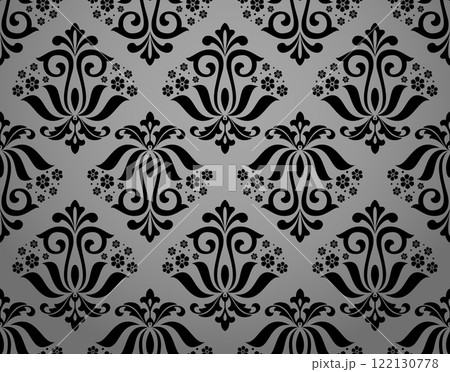 Wallpaper in the style of Baroque. Seamless vector background. Gray and black floral ornament. Graphic pattern for fabric, wallpaper, packaging. Ornate Damask flower ornament 122130778