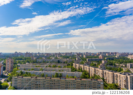 Residential neighborhood featuring panel housing, lush greenery, viewed from above under overcast sky 122136208