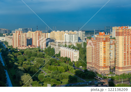 Modern residential towers rising near verdant parks in saint petersburg, blending urban architecture with lush green landscapes 122136209