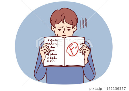Boy shows school notebook with bad mark from teacher and looks down disappointedly after failed test 122136357