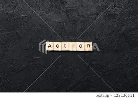 Action word written on wood block. Action text on table, concept Action word written on wood block. Action text on table, concept 122136511