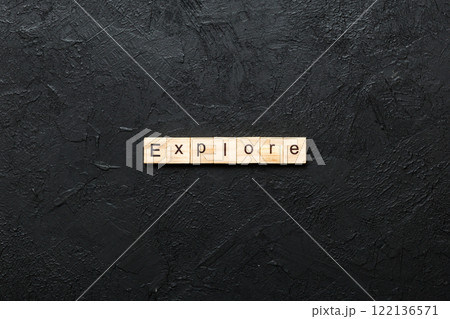 Explore word written on wood block. Explore text on cement table for your desing, concept 122136571
