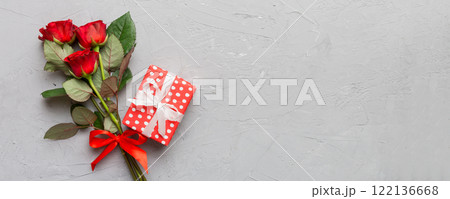 Valentine's day composition with rose flower, red heart and gift boxes on table. mother day and birthday greeting, copy space, top view Valentine's day composition with rose flower, red heart and gift boxes on table. mother day and birthday greeting, copy space, top view 122136668